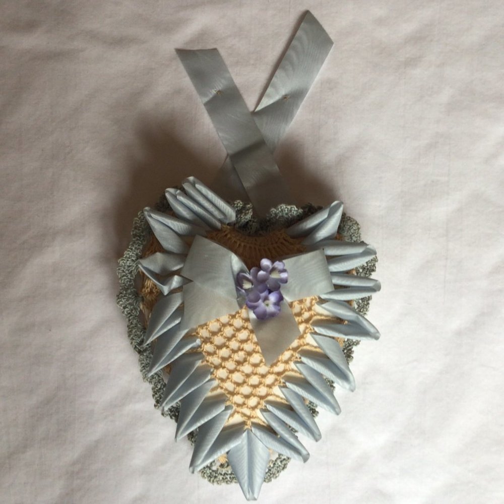 Decorative heart-shaped pincushion wall hanging